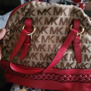 Women shoulder Michael kors and coach bags